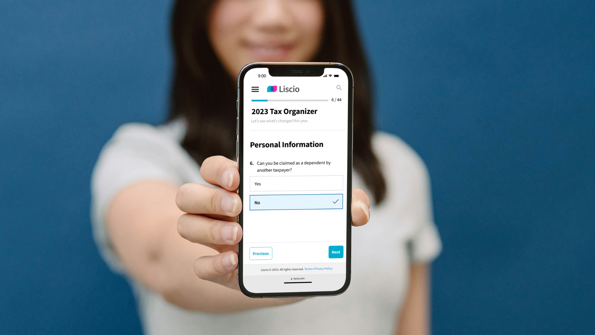 Woman holding a smartphone displaying the Liscio app's 2023 Tax Organizer questionnaire.