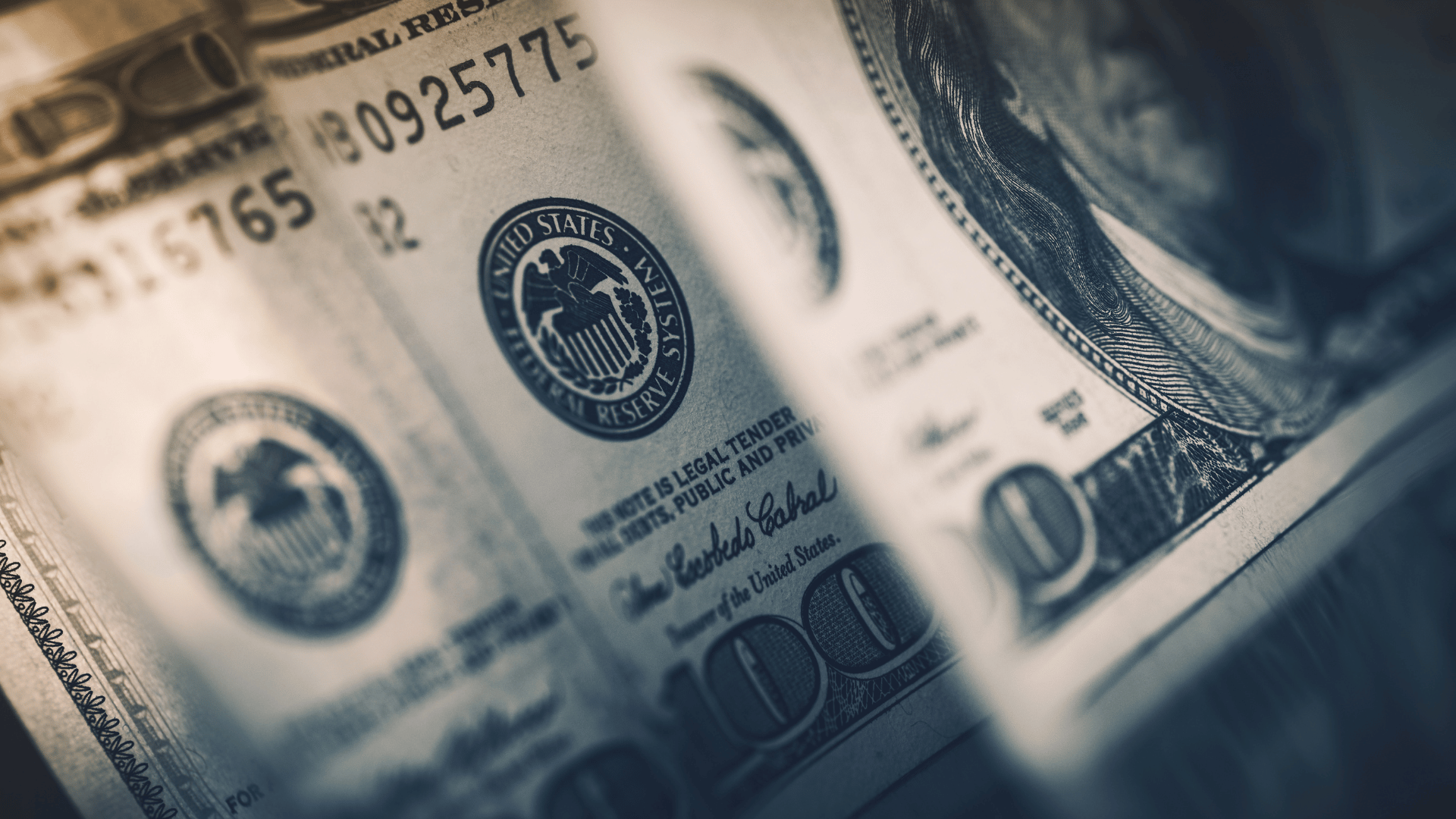 Neat stack of currency representing FileCabinet CS migration cost comparison.