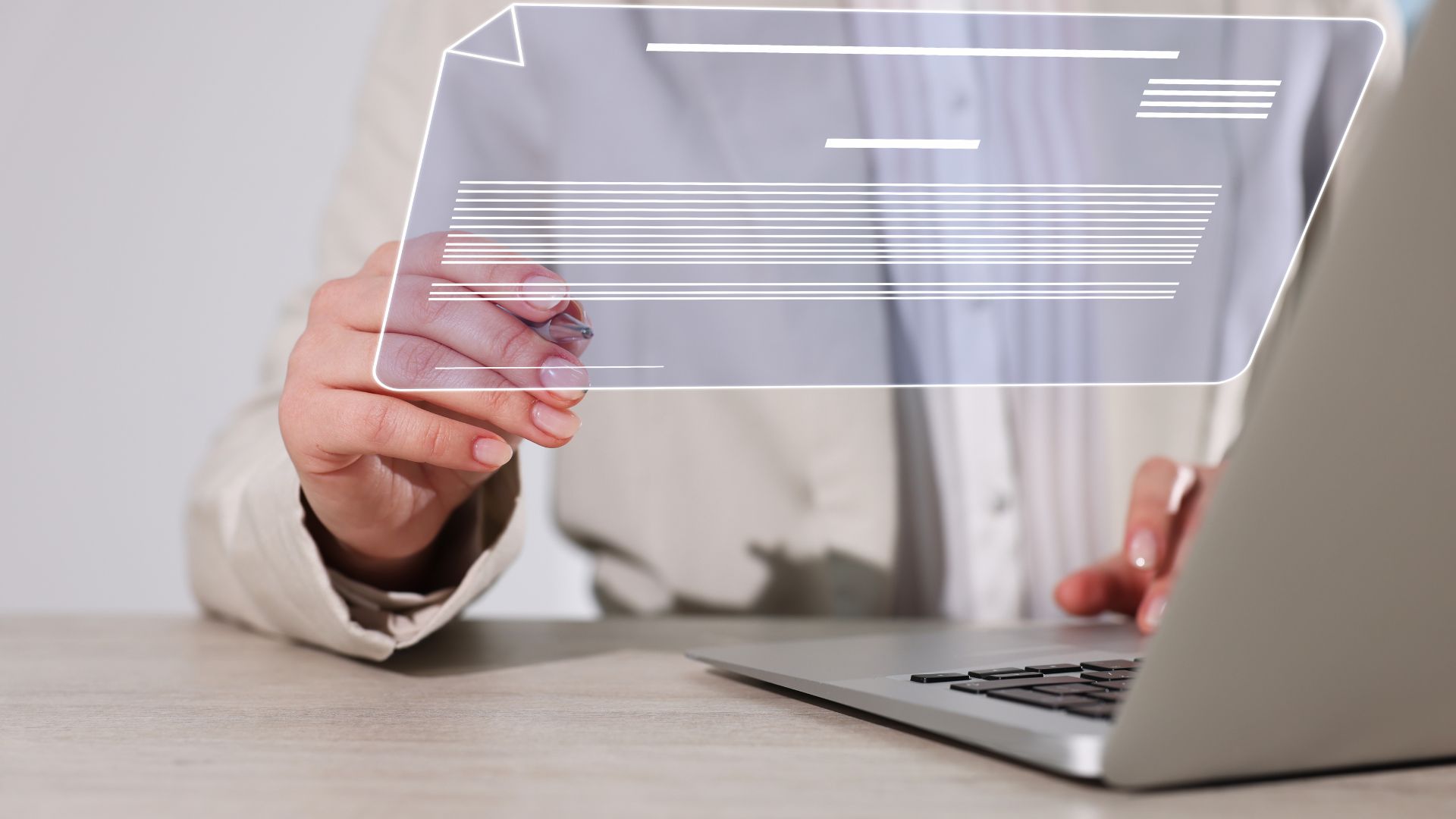 Person signing a digital document on a laptop, representing electronic signature automation.